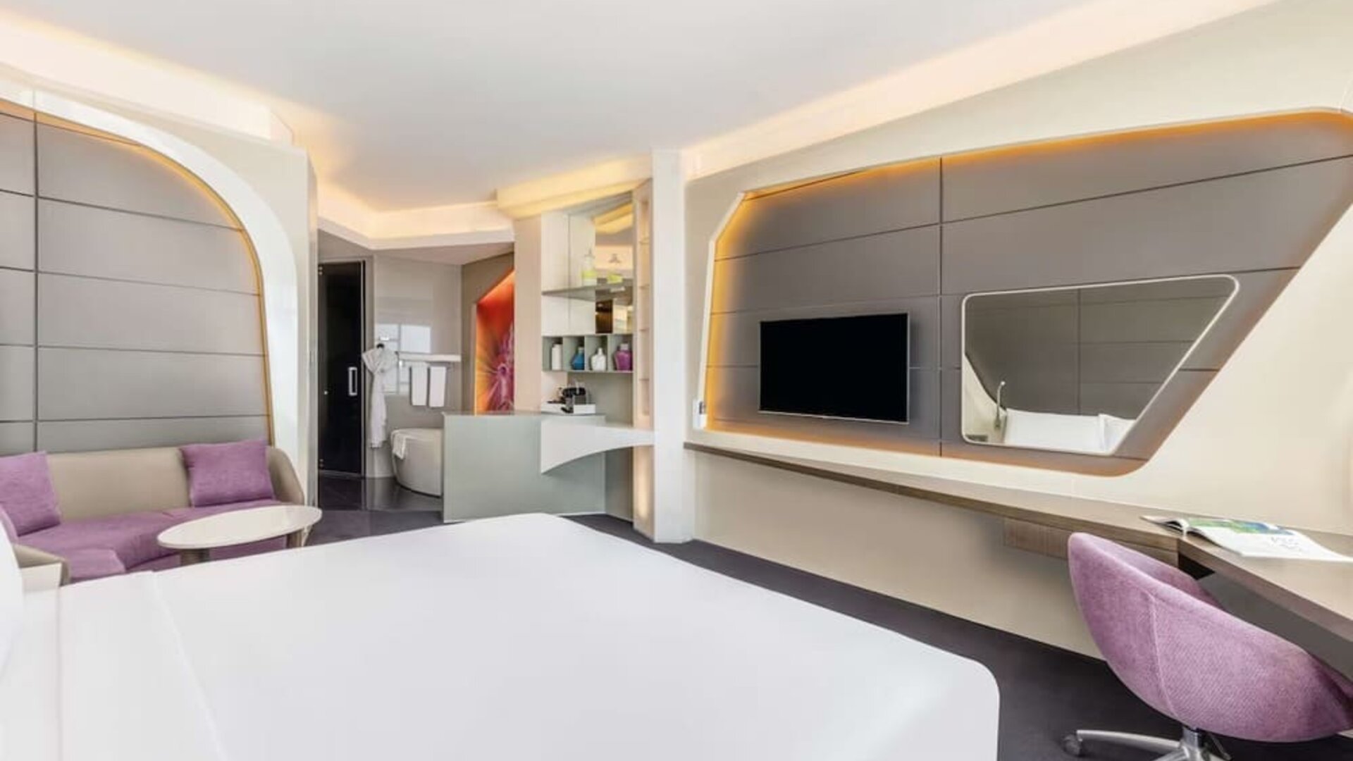 Well-lit king room at V Hotel Dubai.