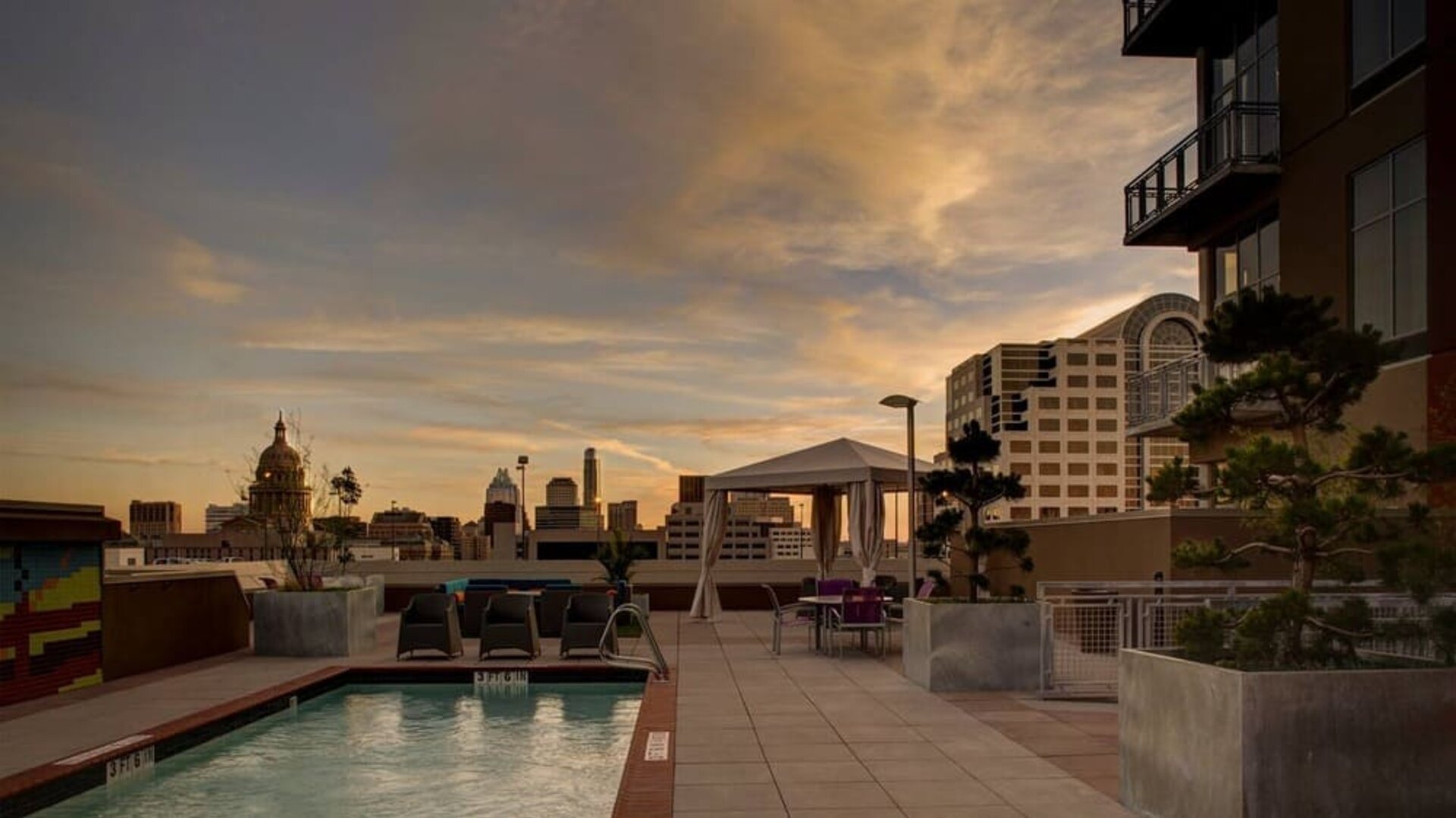 Outdoor pool at sunset at Hampton Inn & Suites Austin @ The UniversityCapitol.