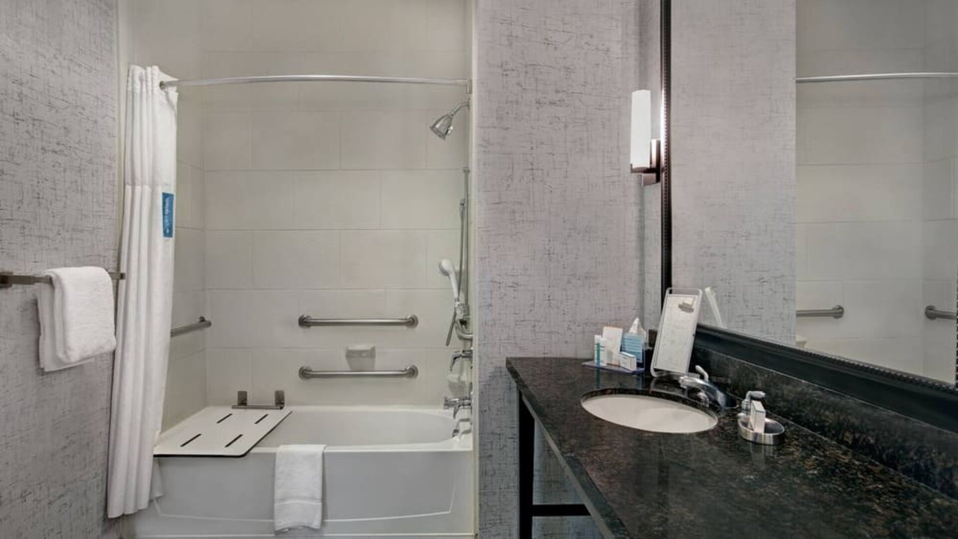 Guest bathroom with shower at Hampton Inn & Suites Austin @ The UniversityCapitol.