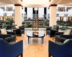 Coworking space and lobby at Embassy Suites By Hilton Portland Airport.