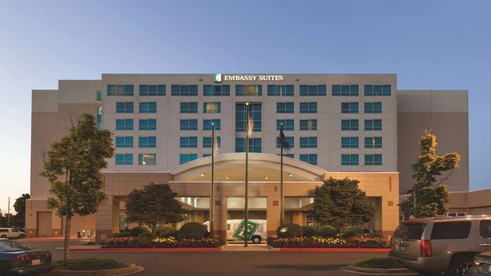 Hotel exterior and parking at Embassy Suites By Hilton Portland Airport.