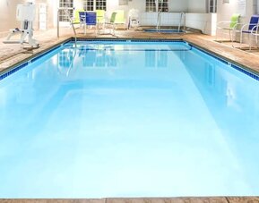 Indoor pool at Coratel Inn & Suites By Jasper Rochester.
