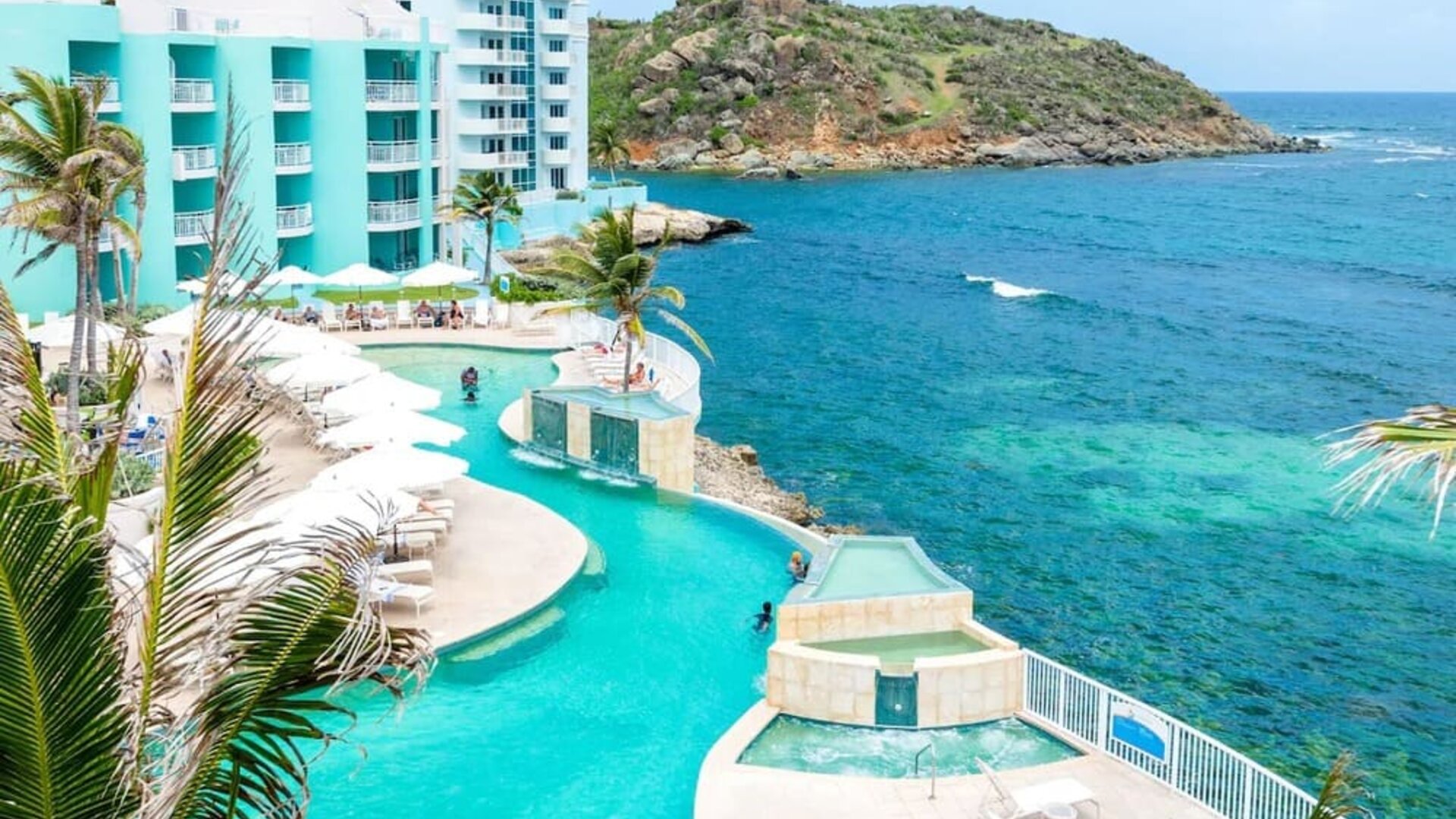 Stunning outdoor pool and ocean view at Oyster Bay Beach Resort.