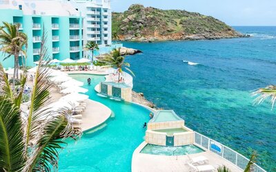 Stunning outdoor pool and ocean view at Oyster Bay Beach Resort.