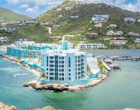 Hotel exterior with sea view and beach access at Oyster Bay Beach Resort.