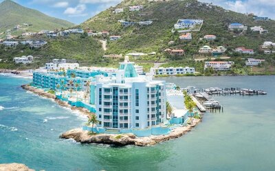 Hotel exterior with sea view and beach access at Oyster Bay Beach Resort.