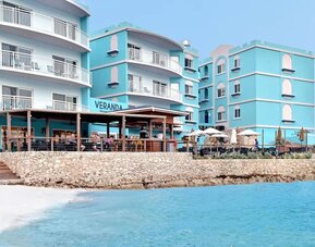 Hotel exterior overlooking the ocean at Oyster Bay Beach Resort.