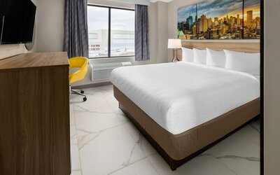 King room with natural light at Days Inn By Wyndham Staten Island.