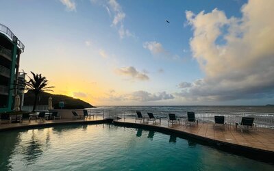Sunset reflecting off the waters of the Infinity Pool at the Oyster Bay Resort in St. Maarten.