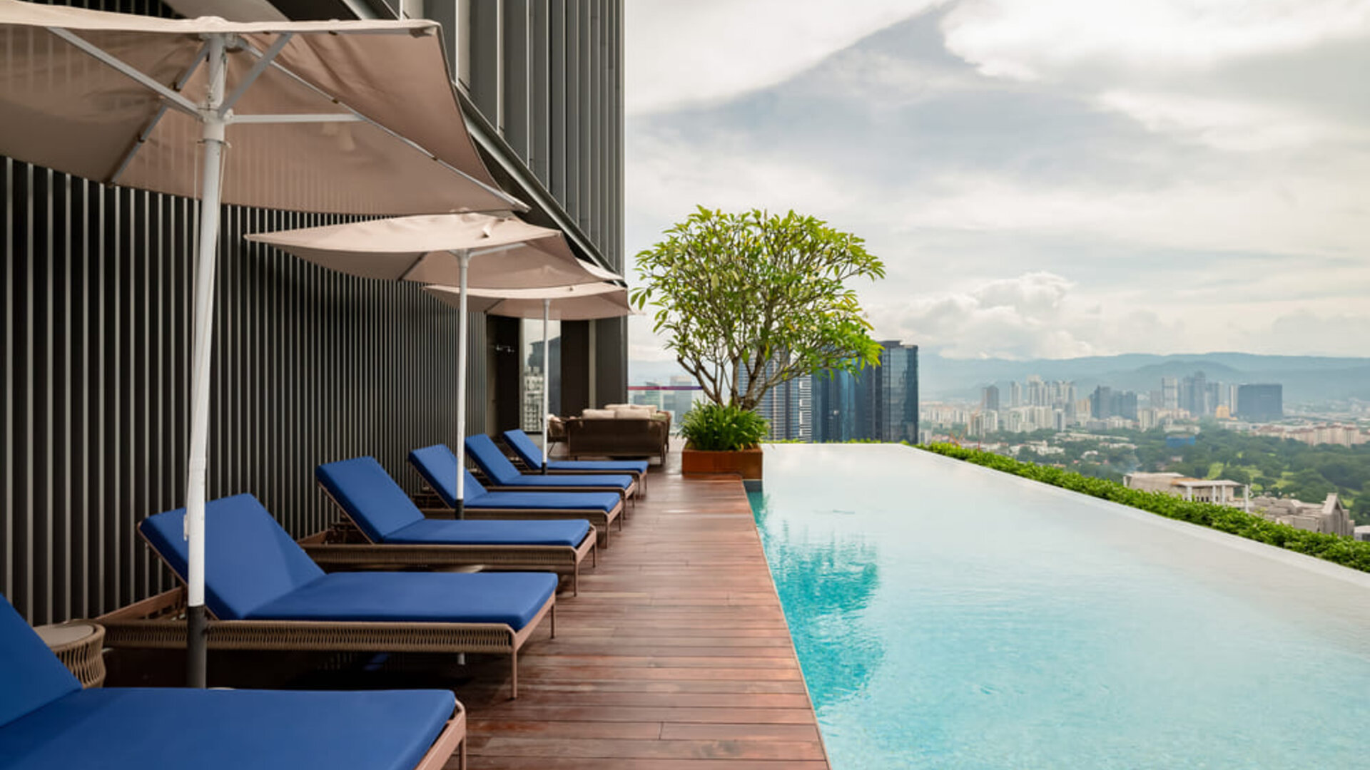 Luxurious outdoor pool with city view at Capri By Fraser Bukit Bintang.