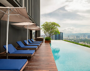 Luxurious outdoor pool with city view at Capri By Fraser Bukit Bintang.
