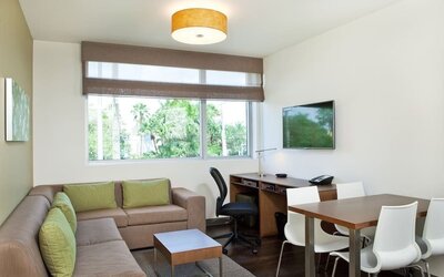 Day room with lounge area at Element Miami Doral.