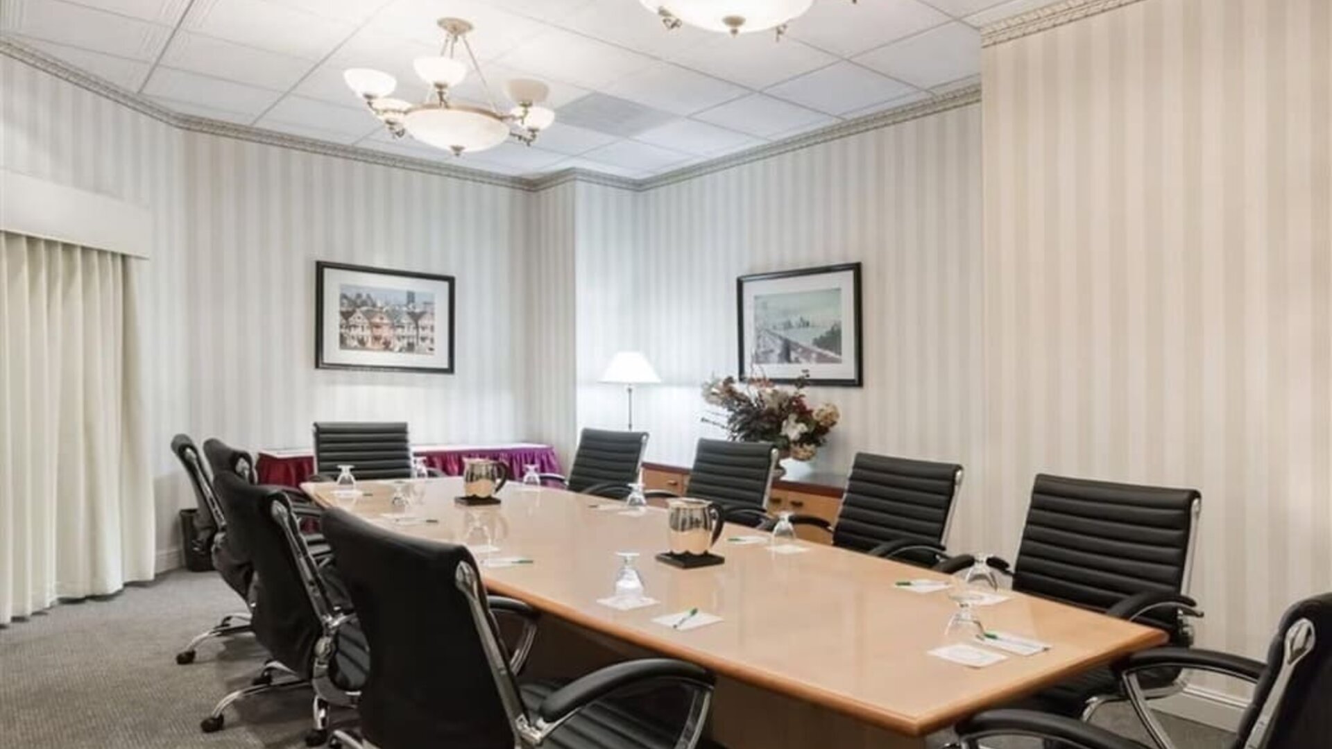 Professional meeting room at Uptown Oasis San Jose Airport.