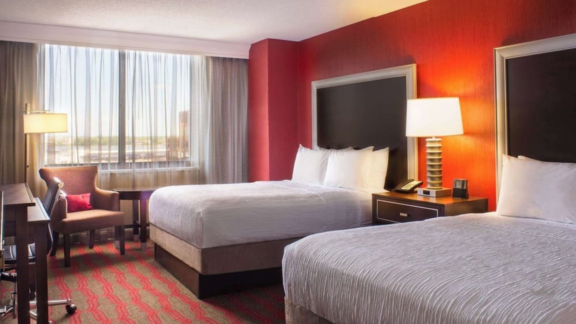 Two queen beds at Laguardia Plaza Hotel.