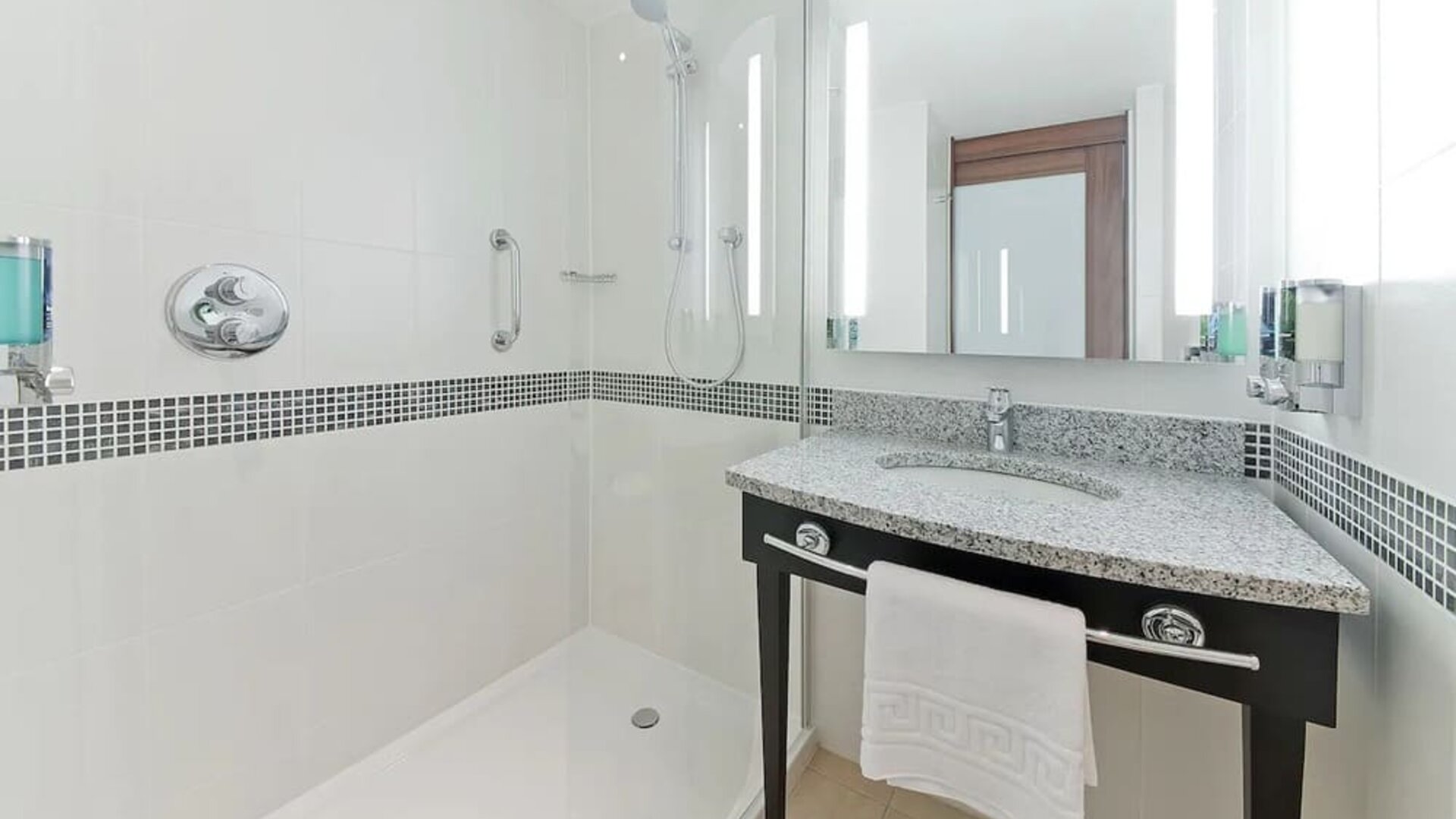 Guest bathroom with shower at Hampton By Hilton London Gatwick Airport.