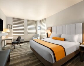 King room with TV at Hotel Marguerite.