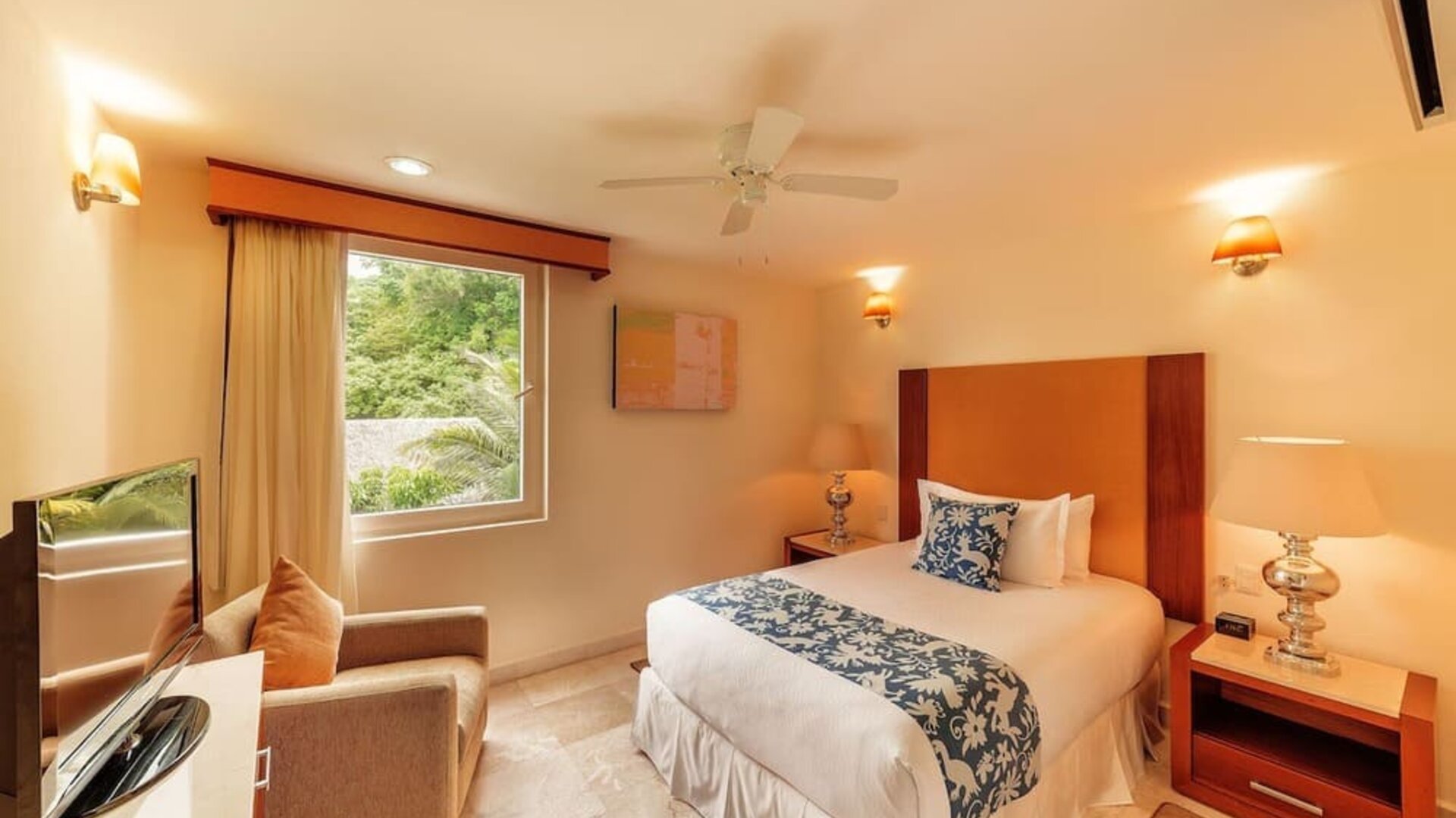 Romantic day use room with TV at Grand Miramar All Luxury Suites & Residences.