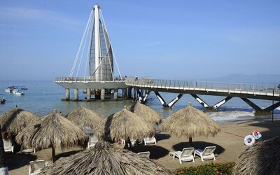 Beach access and marina at Hotel Delfin PV Beach Resort.
