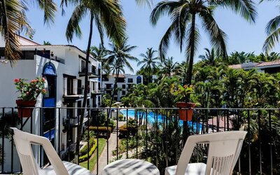 Balcony with pool view at Puerto De Luna Pet Friendly & Family Suites.