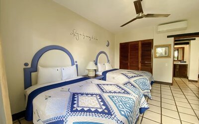 Two queen beds at Puerto De Luna Pet Friendly & Family Suites.