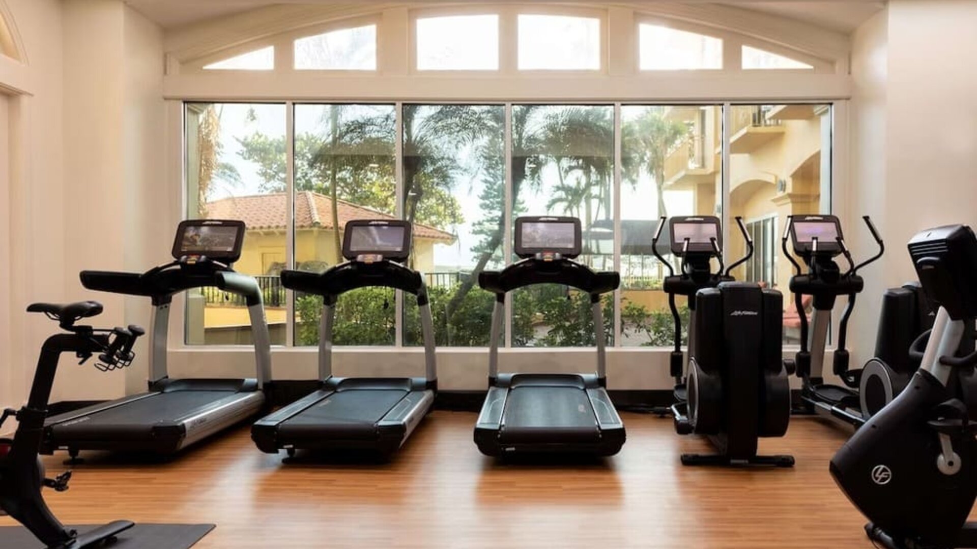 Fitness center available at Embassy Suites By Hilton Deerfield Beach Resort & Spa.