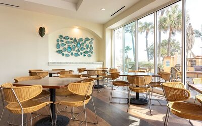 Dining and coworking space at Embassy Suites By Hilton Deerfield Beach Resort & Spa.