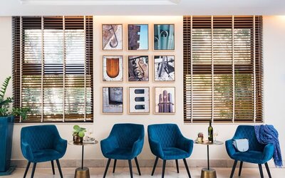 Coworking space and blue chairs at Prima Royale Hotel.