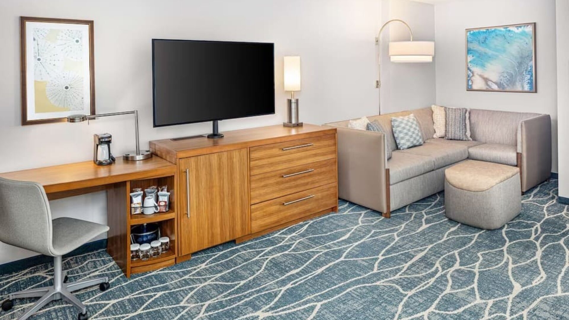 Day room with TV and work space at Hyatt Place Waikiki Beach.