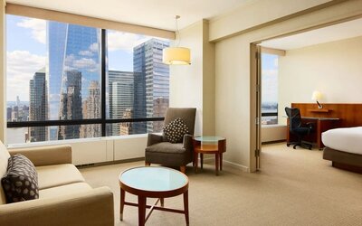 Luxurious king suite with lounge area at M Social New York Downtown.