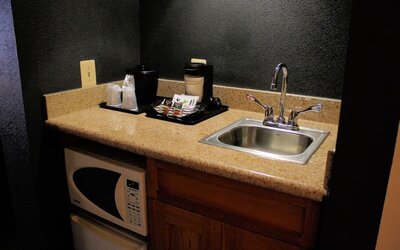 King room with kitchen area at Country Inn & Suites By Radisson, BWI Airport.