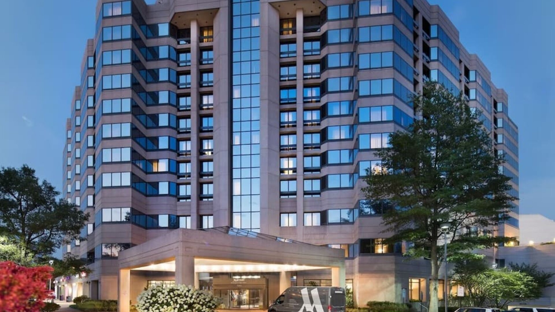 Hotel exterior at night at Washington Dulles Marriott Suites.