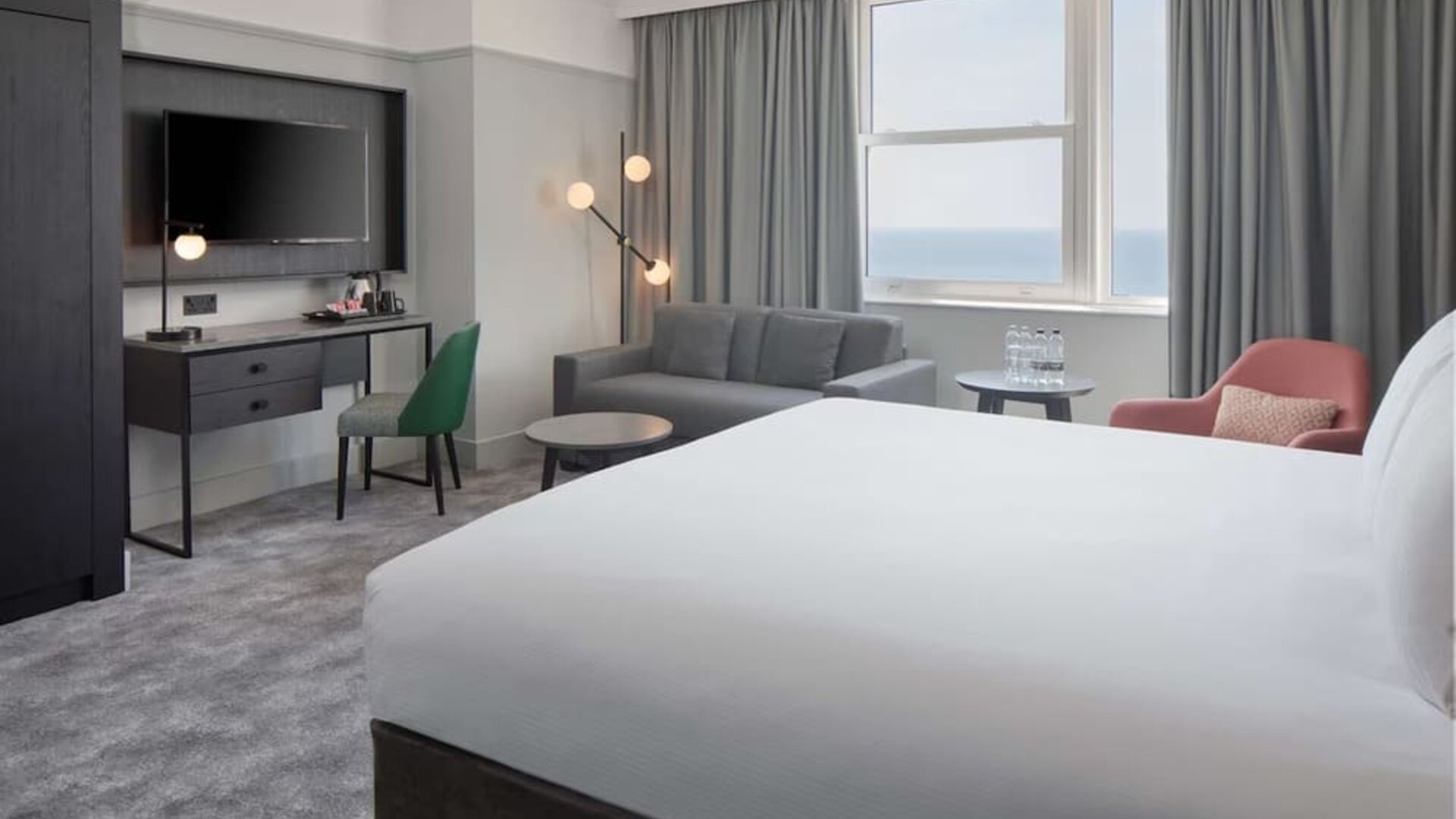 Day use room with work desk and lounge area at DoubleTree By Hilton Brighton Metropole.