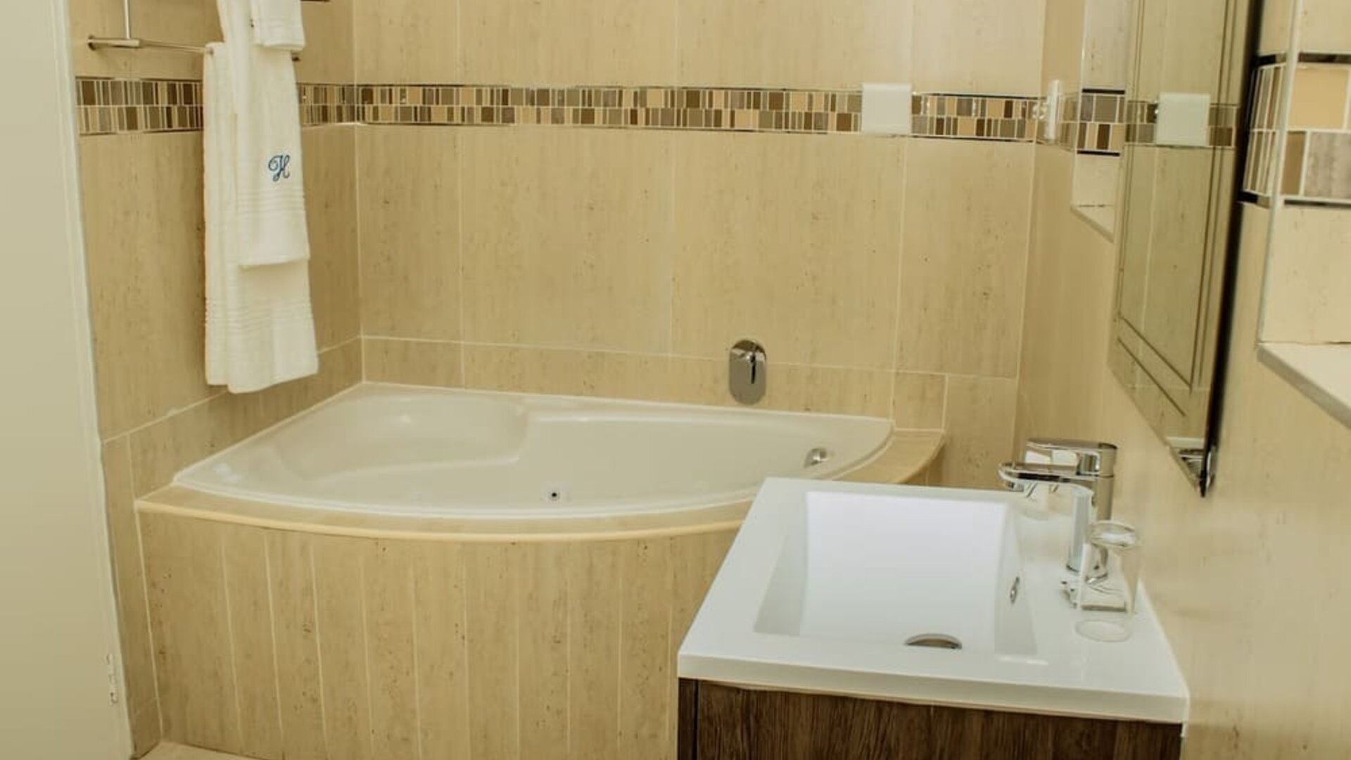 Guest bathroom with tub at Heavenly Boutique Guesthouse. 