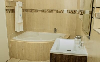 Guest bathroom with tub at Heavenly Boutique Guesthouse. 