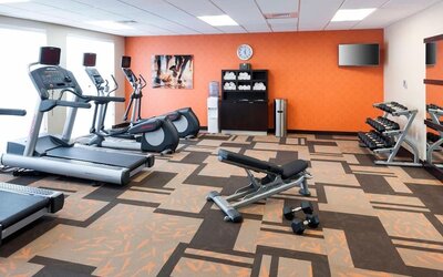 Fitness center available at Courtyard By Marriott Houston North/ Shenandoah. 