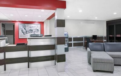 Lobby and coworking lounge at Super 8 Bedford DFW Airport West.  