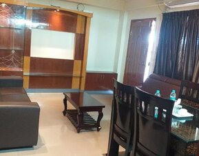 Day room with lounge area at The Nisarga Grand.