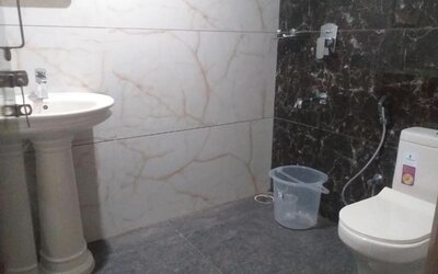 Private bathroom with shower at The Nisarga Grand.