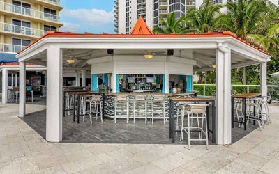 Hotel bar and coworking space at Ramada Plaza Marco Polo Beach Resort.