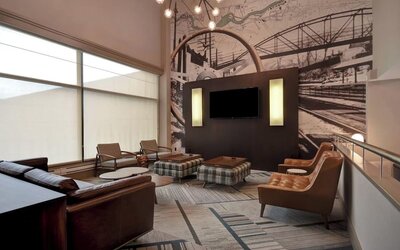 Comfortable hotel lounge featuring modern furnishings, unique décor, and inviting spaces for relaxing or socializing at Four Points by Sheraton Boston-Newton.