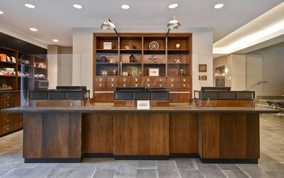 Modern reception desk providing welcoming guest services and efficient check-in experiences at Four Points by Sheraton Boston-Newton.