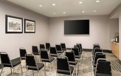 Flexible meeting room equipped for presentations, training sessions, corporate gatherings, and small events at Courtyard by Marriott Boston Brookline.