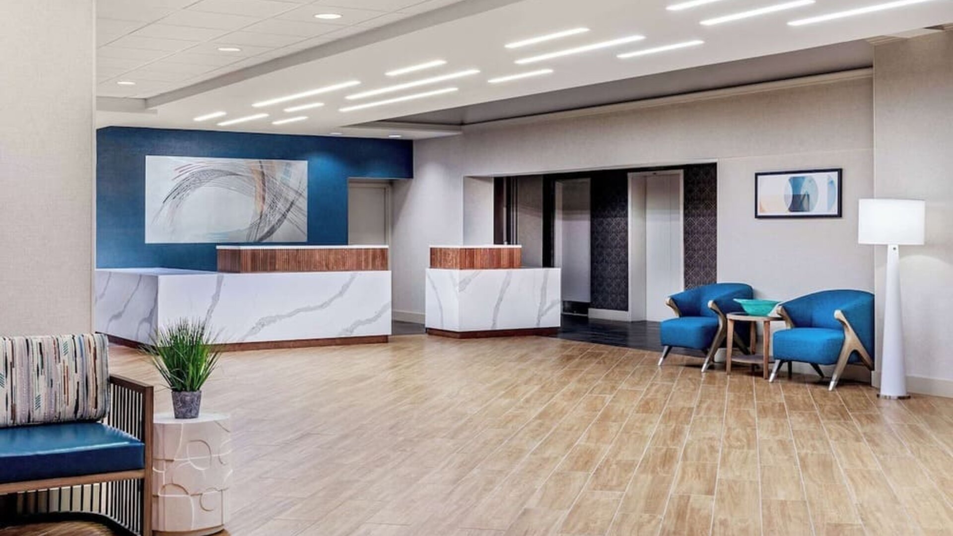 Contemporary hotel lobby with elegant reception desks, modern seating, and a welcoming arrival experience at DoubleTree by Hilton Westborough.
