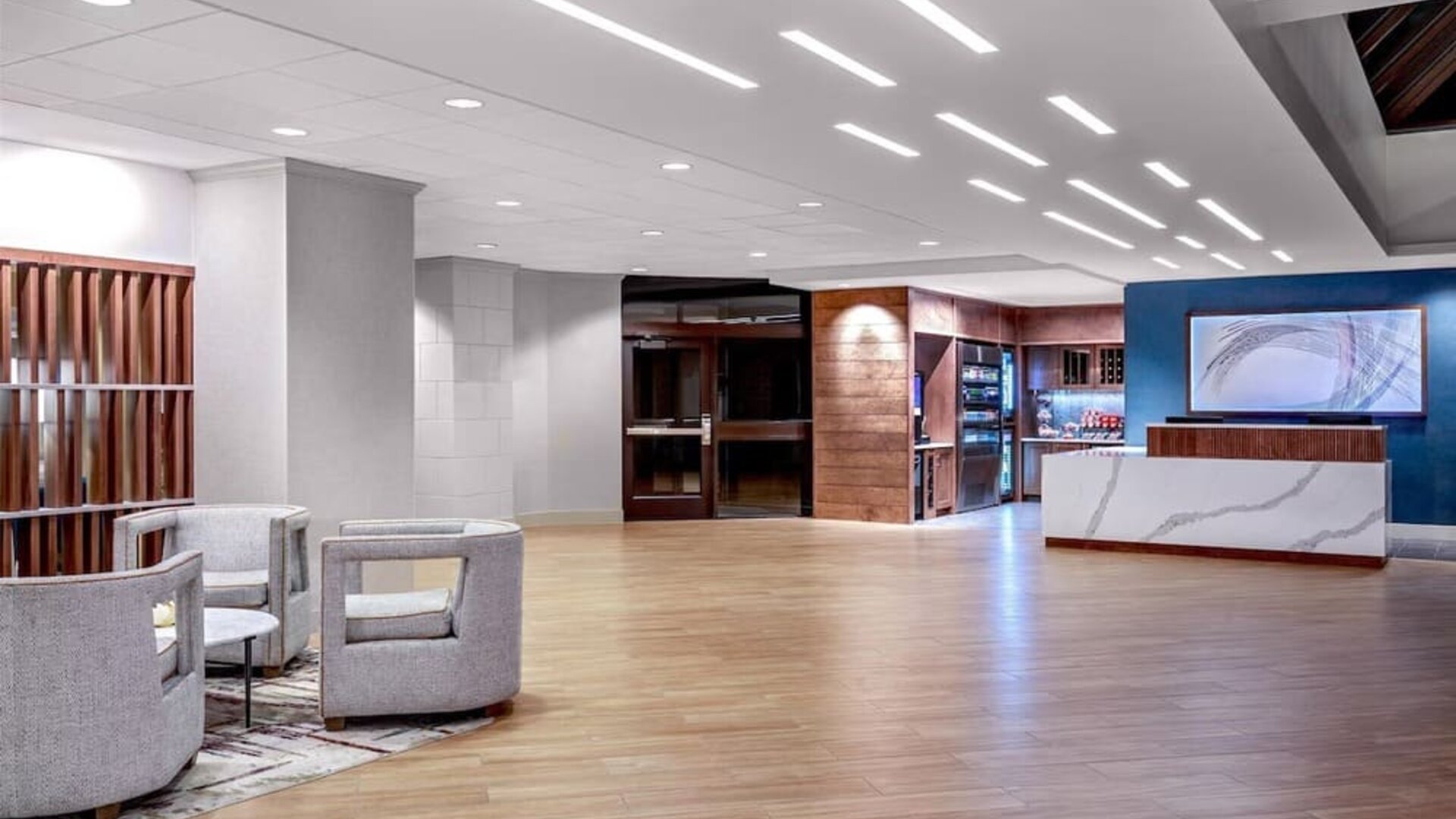 Expansive reception and lobby area offering contemporary furnishings, open gathering spaces, and convenient guest services at DoubleTree by Hilton Westborough.