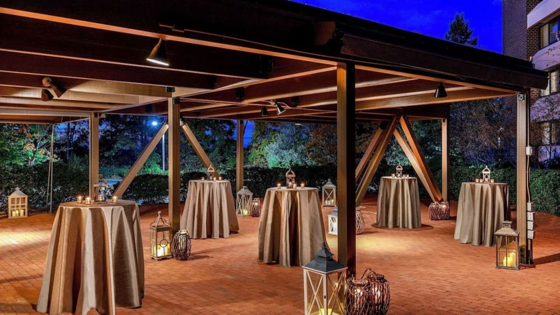 Outdoor event pavilion featuring covered gathering space, ambient lighting, and an elegant setting for receptions, celebrations, and social events at DoubleTree by Hilton Westborough.