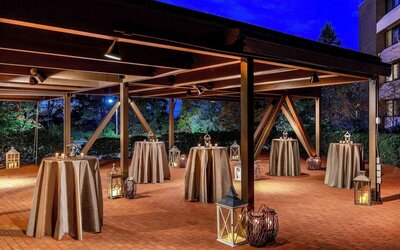 Outdoor event pavilion featuring covered gathering space, ambient lighting, and an elegant setting for receptions, celebrations, and social events at DoubleTree by Hilton Westborough.