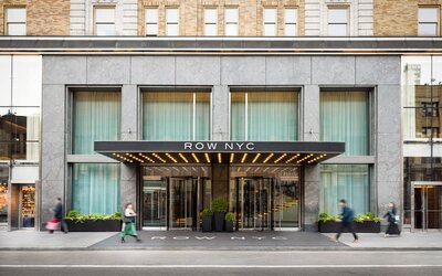 Main entrance of Row NYC featuring a contemporary façade, elegant lighting, and a welcoming arrival experience in the heart of New York City.