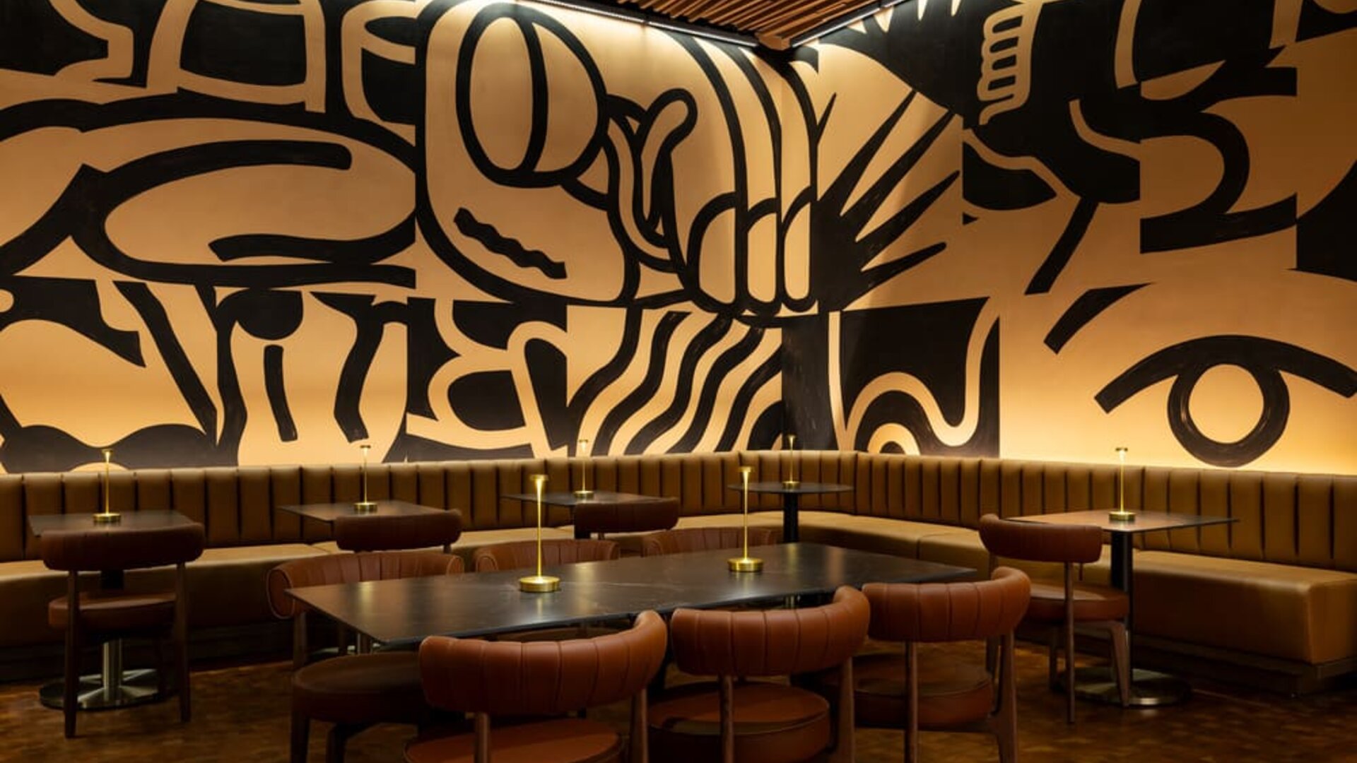 Unique dining and gathering space featuring bold artistic design, modern seating, and a vibrant atmosphere at Row NYC.