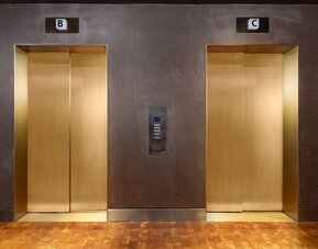 Modern elevator area featuring contemporary finishes and convenient access to guest accommodations and hotel amenities at Row NYC.