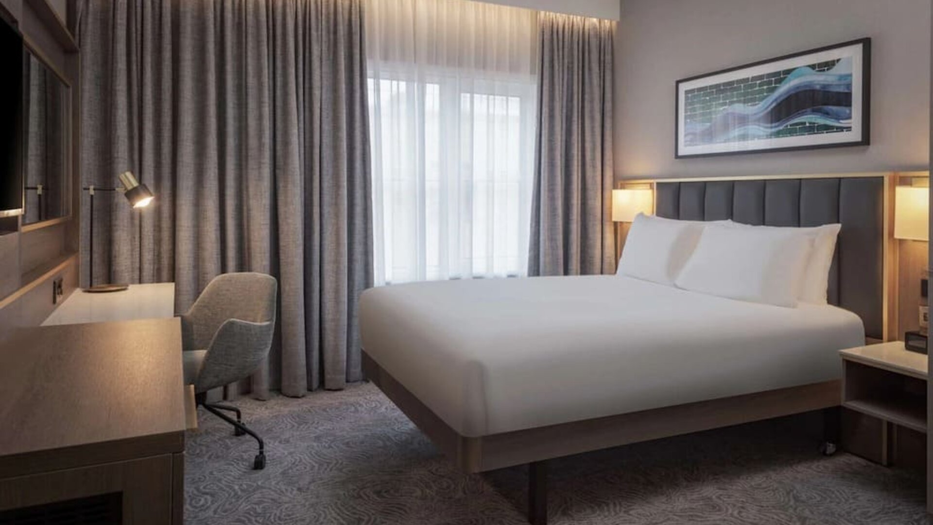 King bedroom with natural light at DoubleTree By Hilton London Angel Kings Cross.